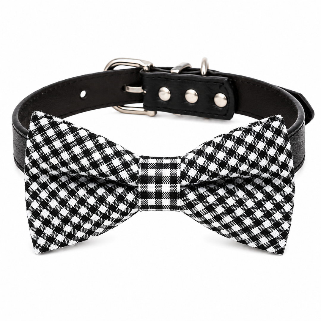 Black and white gingham dog bow tie attached to a black vegan leather dog collar with silver hardware