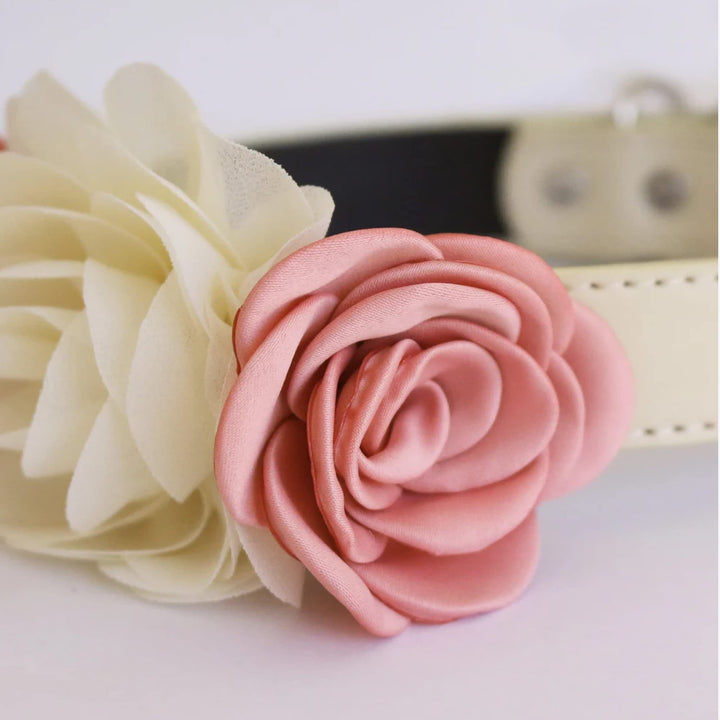 Close-up of blush pink rose and ivory flower arrangement on a vegan leather dog collar.