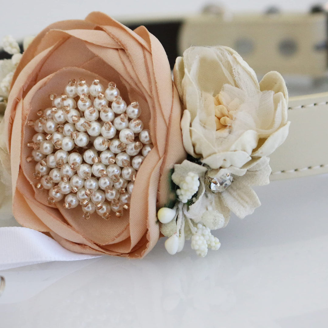 Blush pink ring bearer dog collar with pearl center flower, ivory floral accents, and decorative wedding ring charm