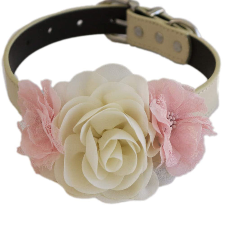 Handmade dog collar featuring an ivory rose centerpiece with blush pink lace flower accents on both sides.