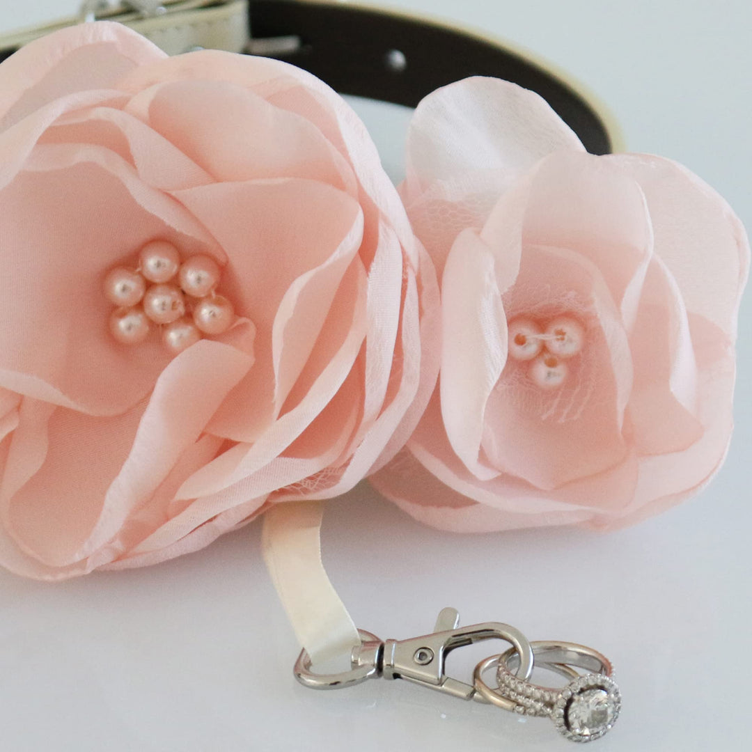 Close-up of blush pink flower dog collar with pearl center accents and detachable ring bearer holder