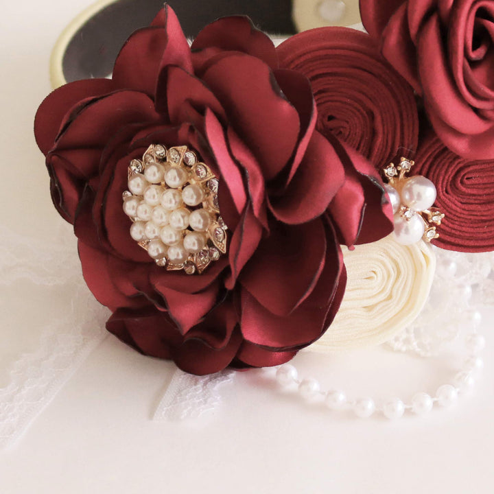 Burgundy floral dog collar with pearl centerpiece, rose accents, lace details, and elegant wedding-inspired design