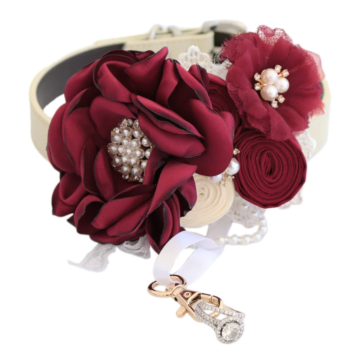 Elegant burgundy floral dog collar featuring layered flowers, pearl embellishments, ivory accents, and ring bearer charm for weddings and special events