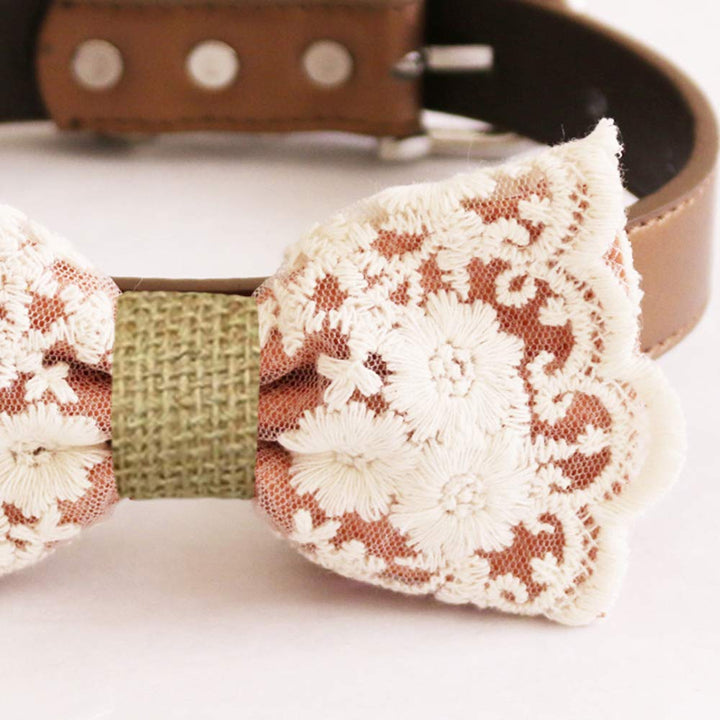 Copper floral lace dog bow tie close-up featuring embroidered cream lace flowers, scalloped lace edges, and textured olive center wrap