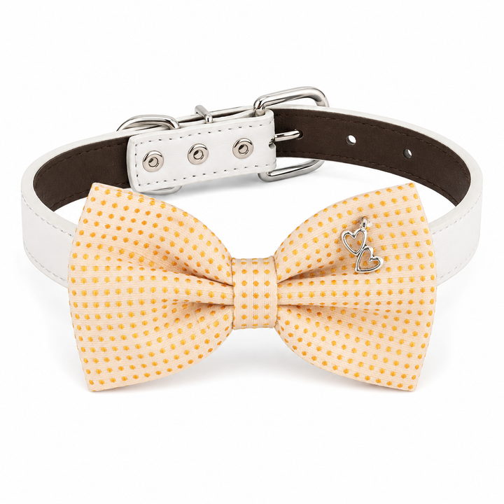 Cream dog bow tie collar with gold mini dot pattern, silver double heart charm, white vegan leather collar, and silver-tone hardware