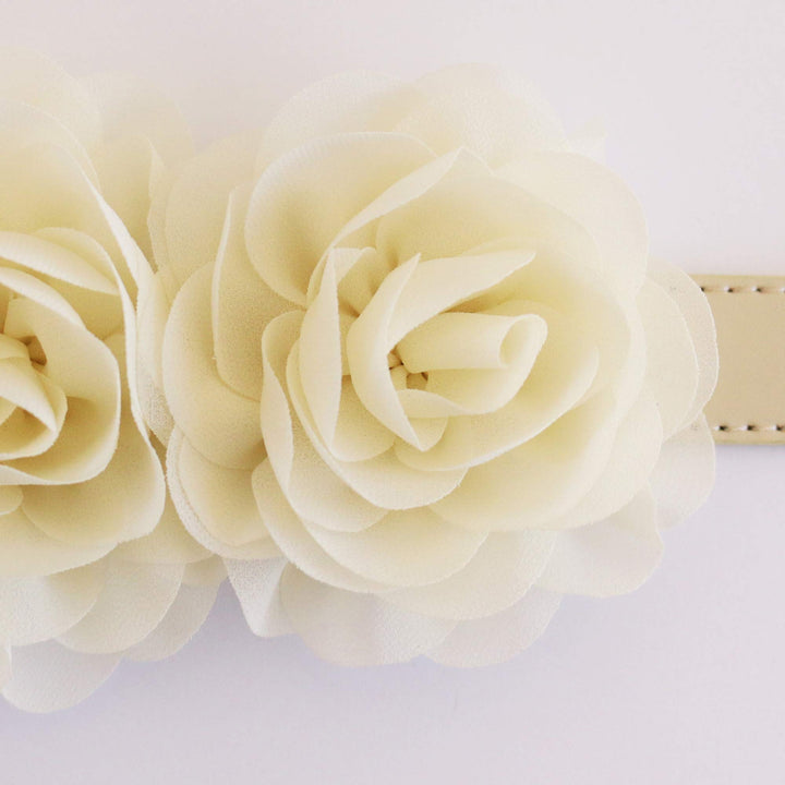 Close-up of double ivory rose floral dog collar with handcrafted chiffon flowers on a vegan leather collar.