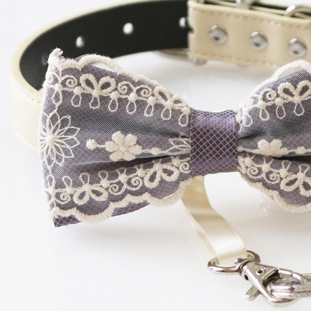 Dusty lavender lace ring bearer dog bow tie collar with floral embroidered lace overlay, satin center accent, adjustable vegan leather collar, and attached wedding ring holder ribbon