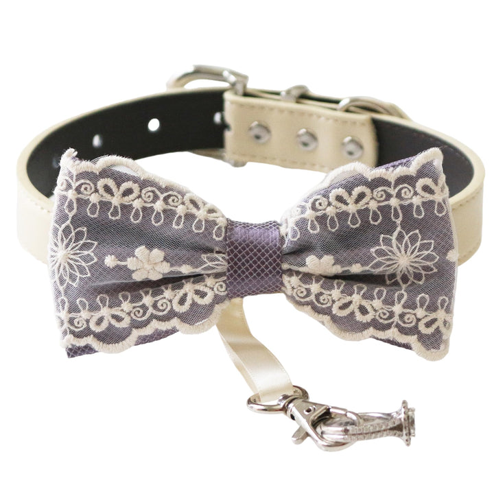 Dusty lavender ring bearer dog bow tie collar featuring embroidered floral lace detailing, satin center wrap, vegan leather collar, and attached wedding ring holder ribbon for weddings and ceremonies