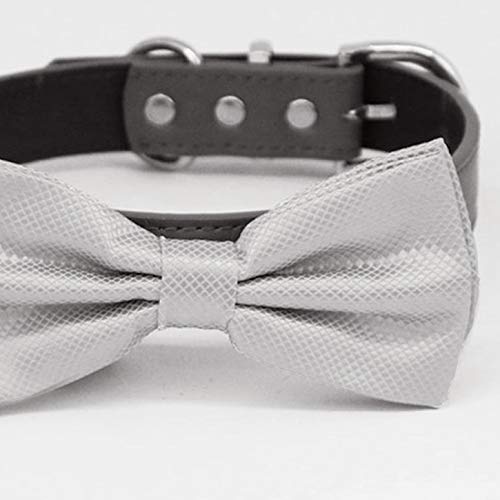 Close-up of a gray textured satin dog bow tie attached to a black vegan leather collar.