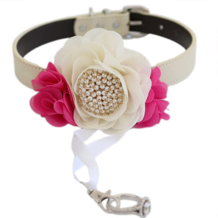 Handmade dog wedding collar featuring an ivory flower centerpiece, hot pink floral accents, pearl embellishments, and ring bearer ribbon attachment.