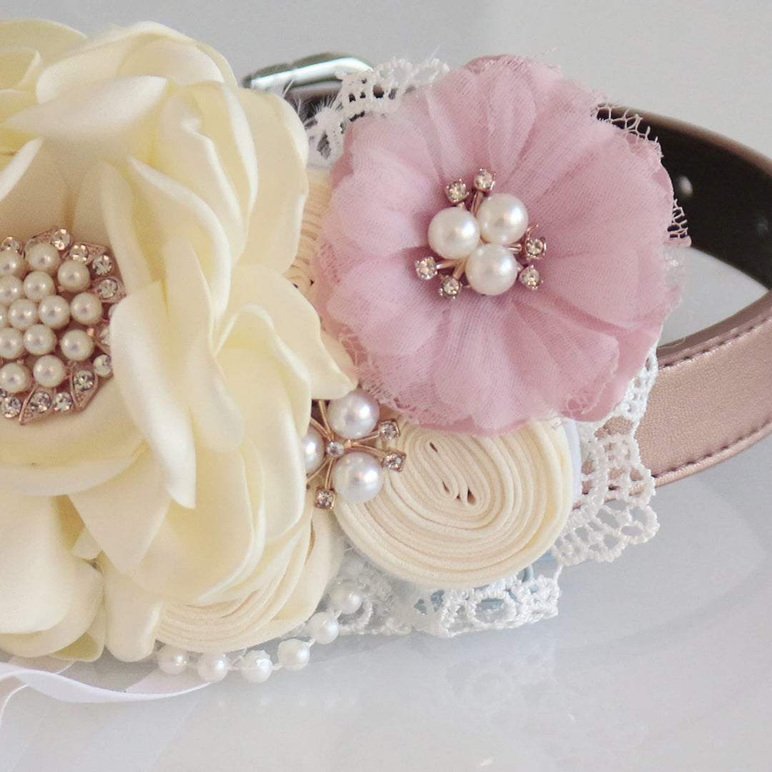 Close-up of ivory and blush floral ring bearer dog collar with pearl accents, lace detail, and decorative flower arrangement.