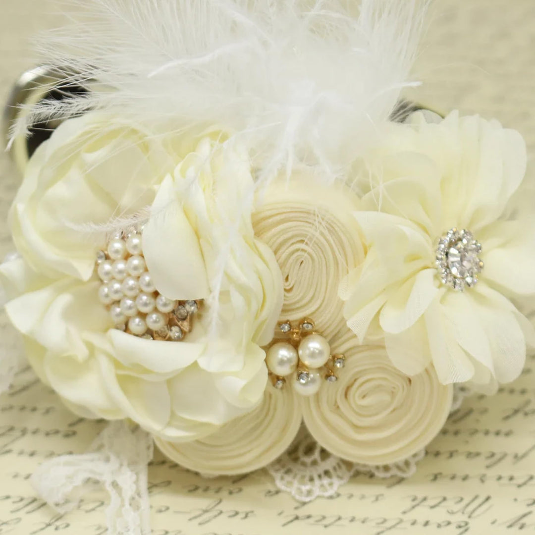 Ivory feather floral wedding dog collar with pearl flower center, handcrafted rolled flowers, lace accents, and elegant bridal design.