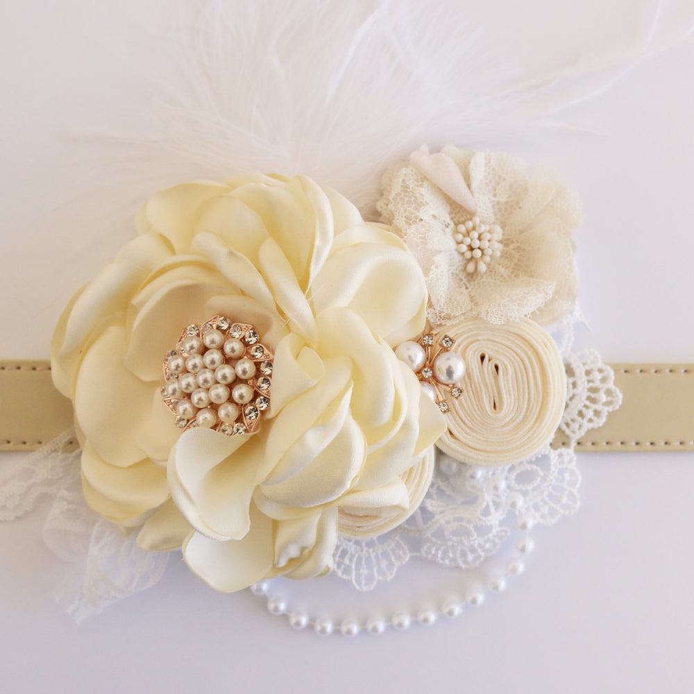 Ivory floral dog collar with pearl centerpiece, lace flower accent, feather detail, and pearl trim.