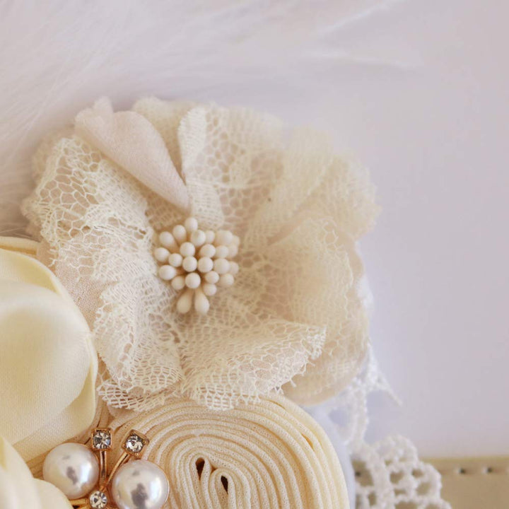Ivory lace flower detail with pearl center accent on a handmade floral dog collar.