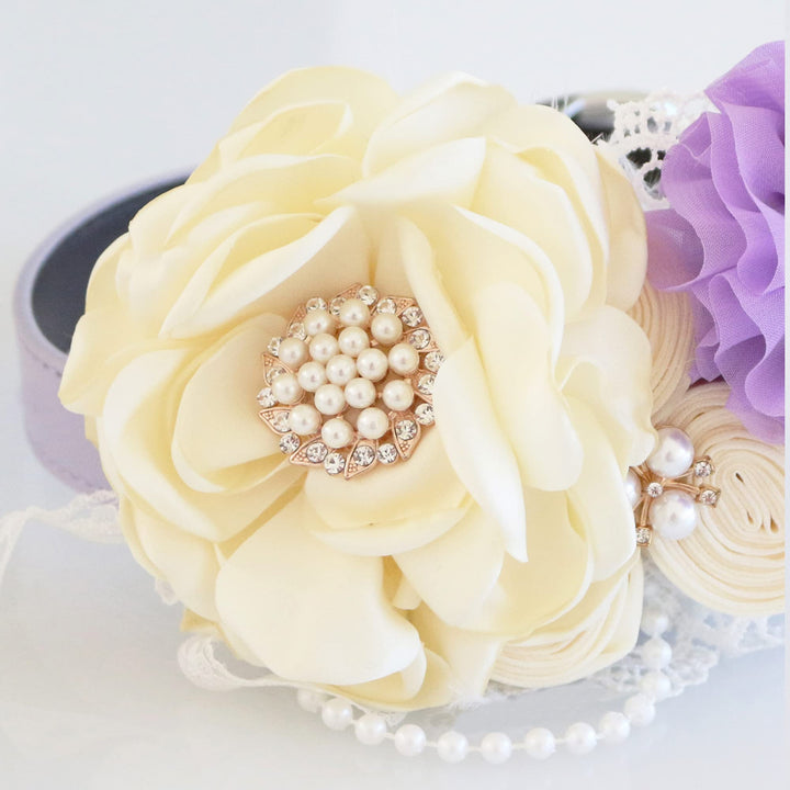 Ivory and lilac floral ring bearer dog collar with pearl accents, lace details, handcrafted flowers, and decorative wedding ring charm