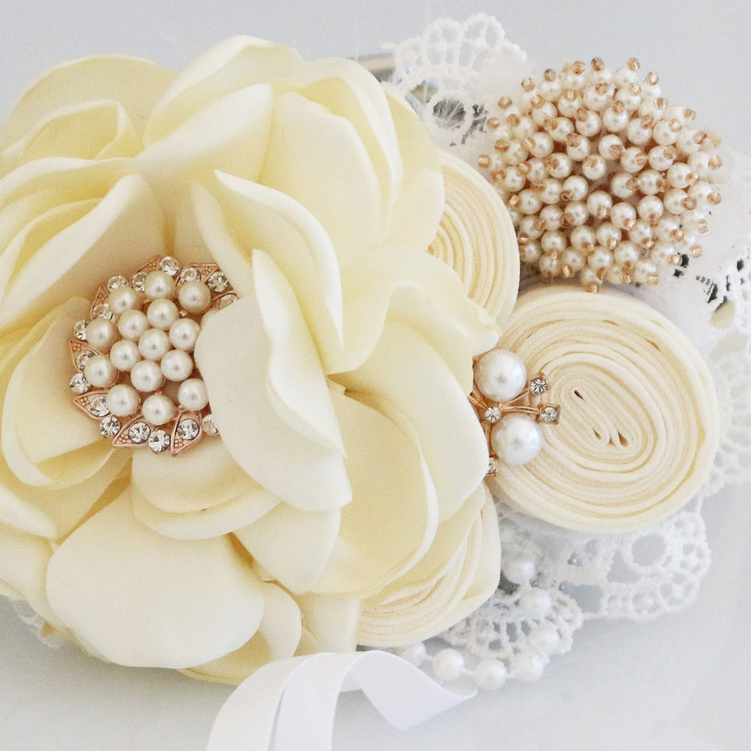 Ivory floral ring bearer dog collar with pearl centerpiece, rolled fabric flowers, lace accents, and ribbon ring holder.