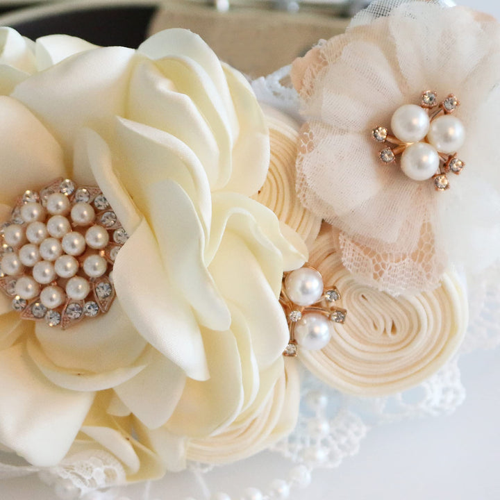 Ivory floral dog collar with pearl centerpiece, lace flower accent, handmade rosette flowers, and elegant wedding design.