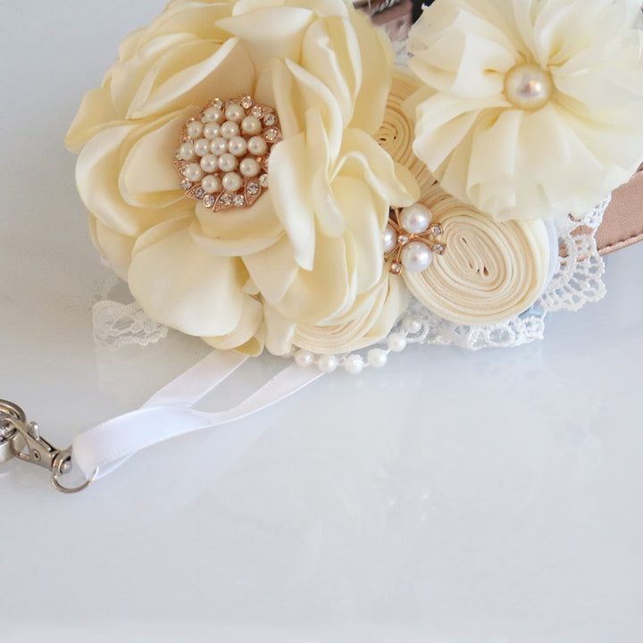Ivory ring bearer dog collar with pearl flower centerpiece, handmade rosette flowers, lace accents, and detachable ring holder ribbon.