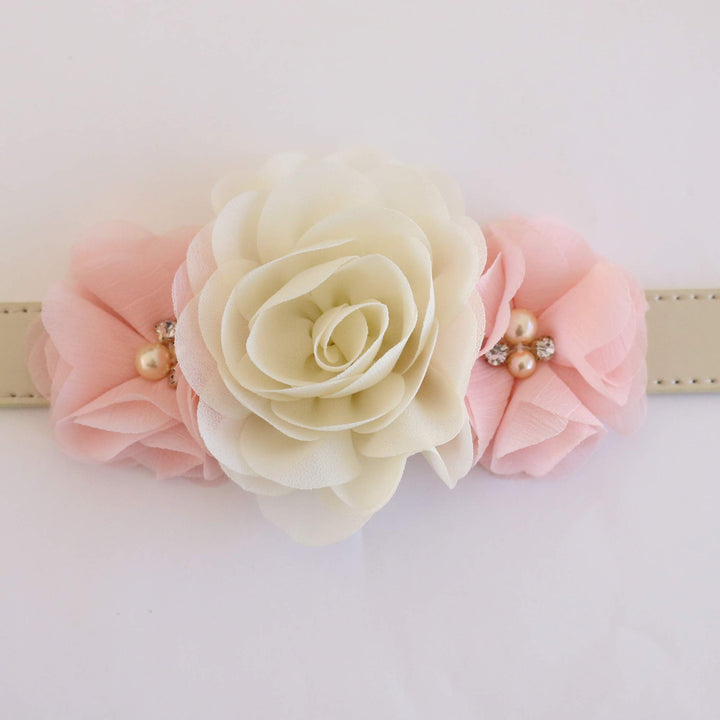 Dog collar featuring an ivory rose centerpiece with blush pink floral accents and pearl details.