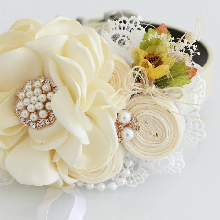 Ivory floral ring bearer dog collar with pearl centerpiece, rustic yellow flower accent, lace details, detachable ring holder ribbon, and vegan leather collar.