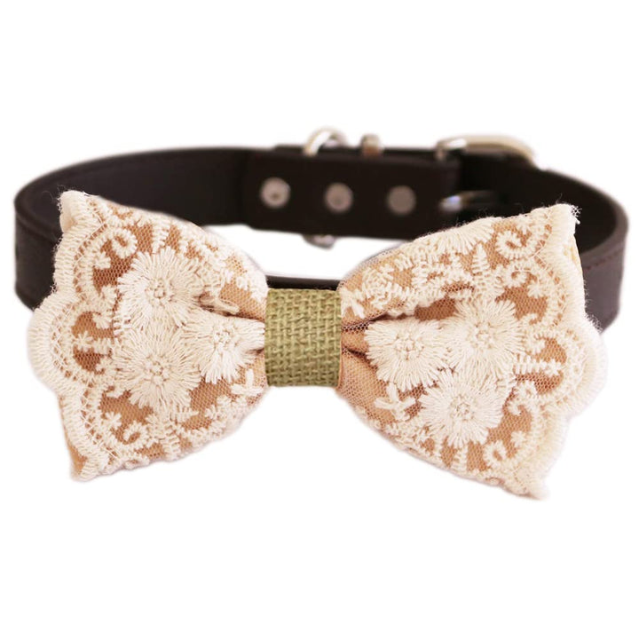 Beige floral lace dog bow tie attached to a dark brown vegan leather dog collar.