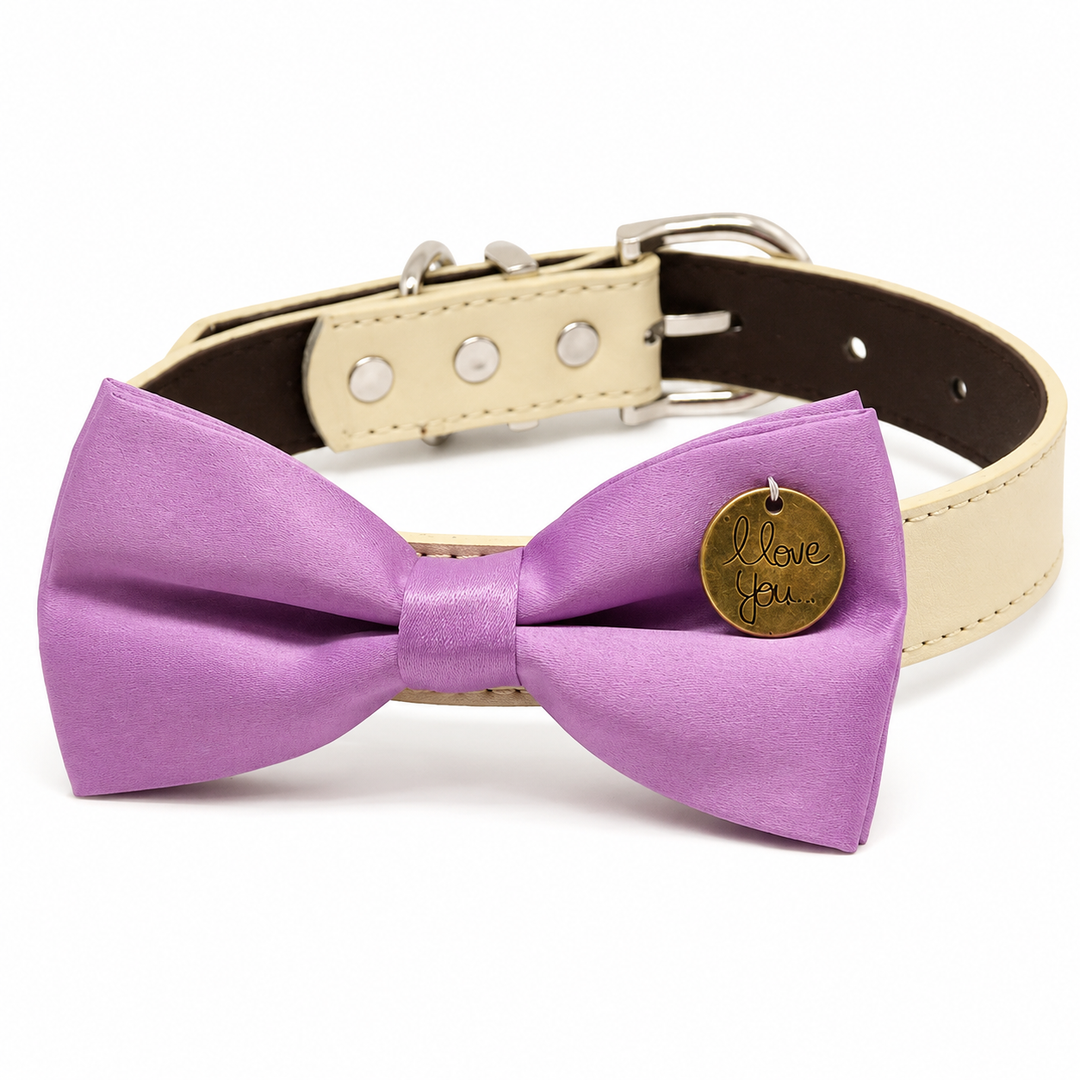 Lavender dog bow tie with round love you charm attached to an ivory vegan leather collar
