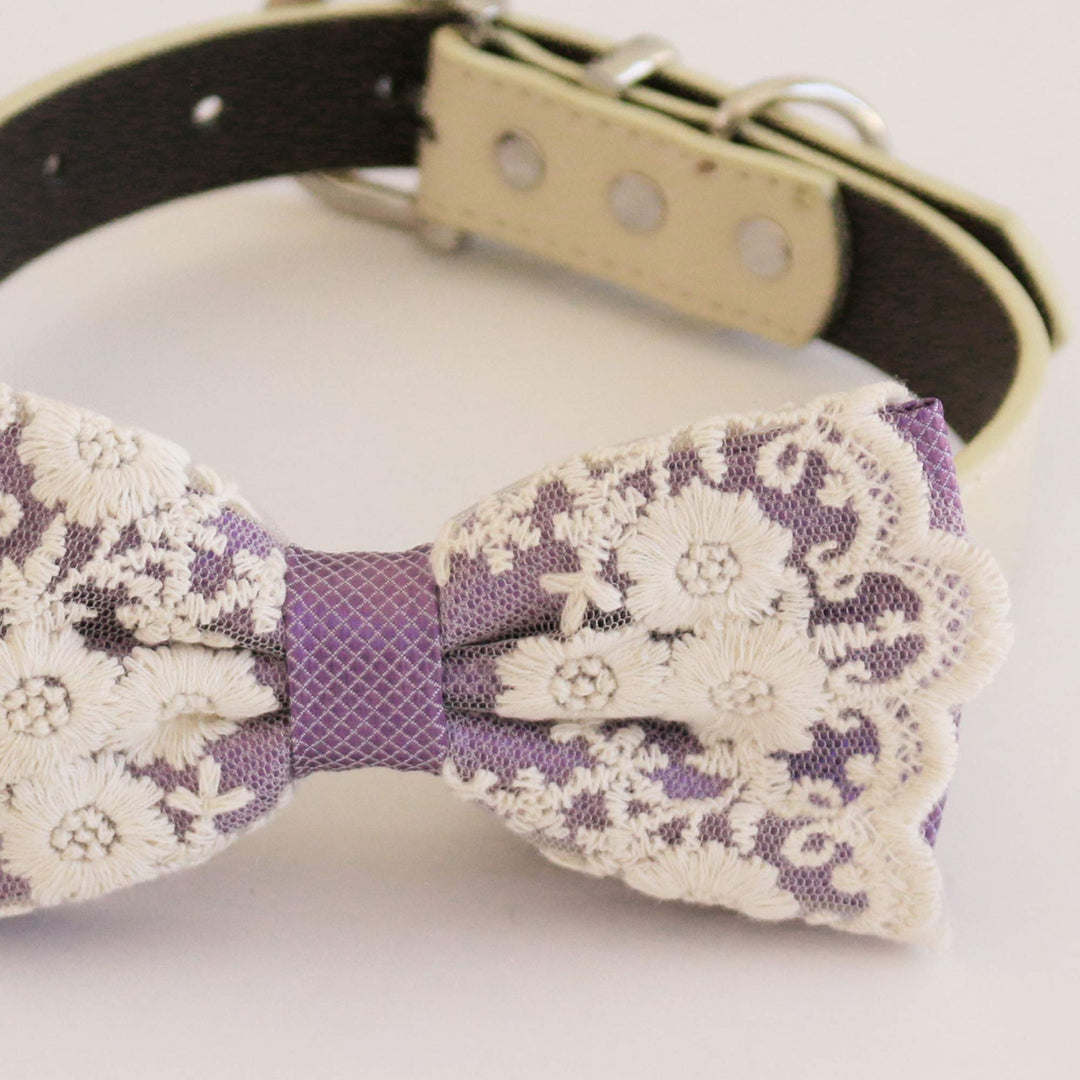 Lavender floral lace dog bow tie close-up showing embroidered flower details, scalloped lace edges, and textured lavender center band