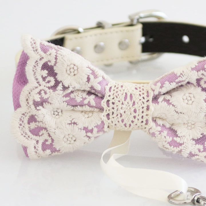 Close-up detail of lavender ring bearer dog bow tie with floral lace embroidery and attached wedding ring holder ribbon