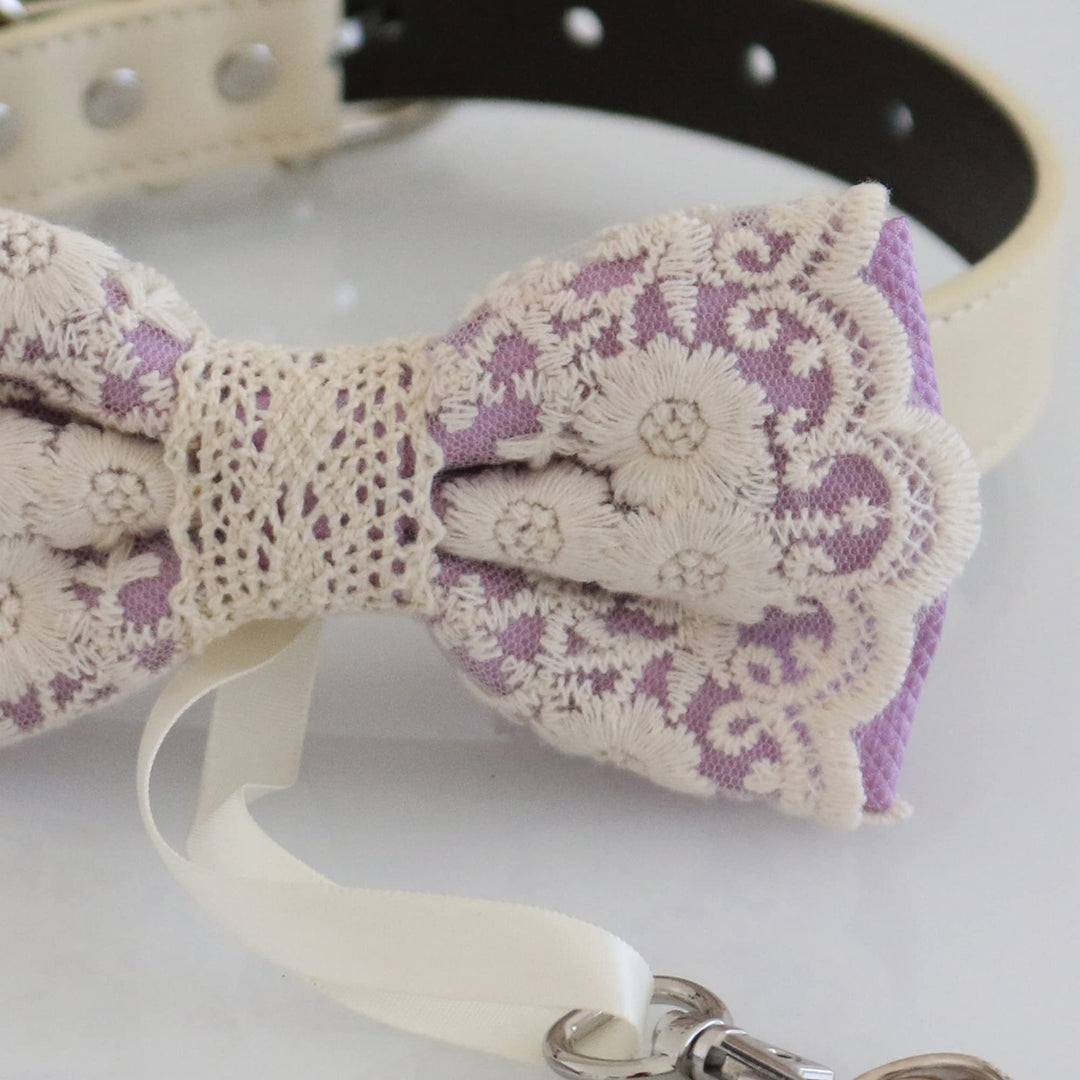 Close-up detail of lavender ring bearer dog bow tie featuring embroidered floral lace overlay and attached wedding ring holder ribbon