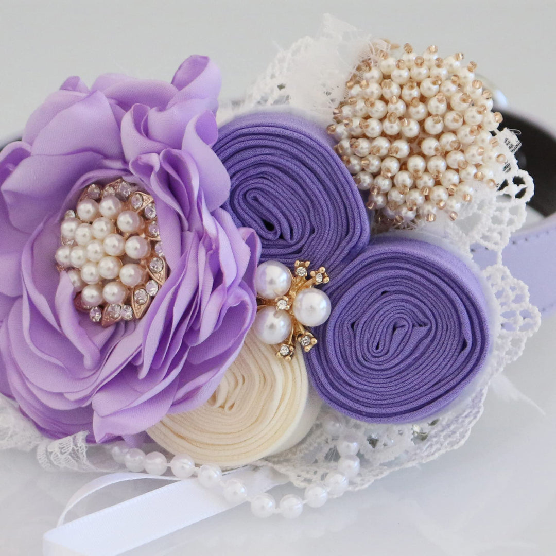 Close-up of lilac floral ring bearer dog collar with pearl accents, lace details, and decorative ribbon roses.