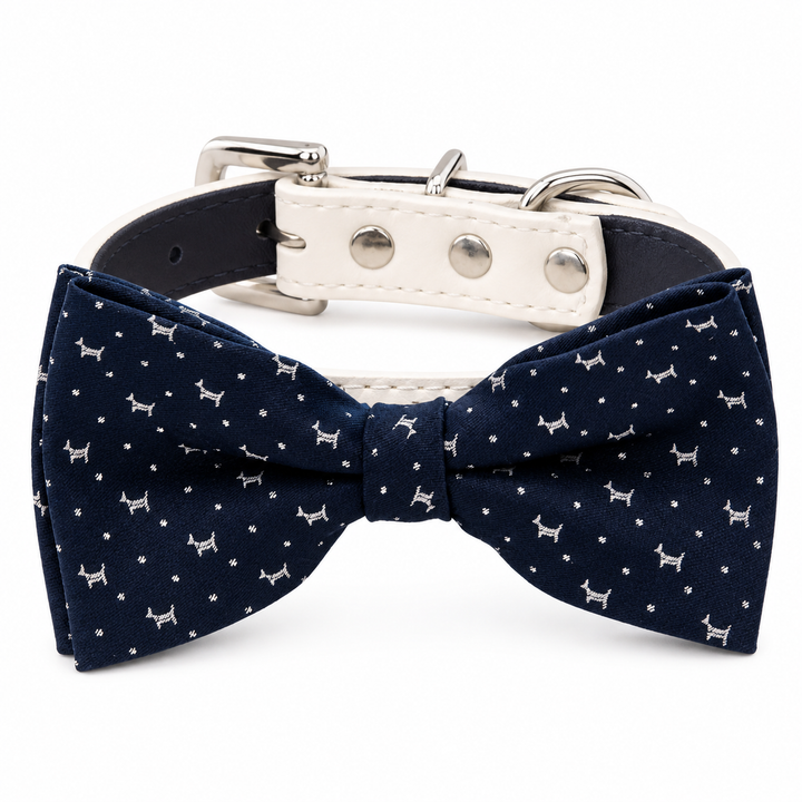 Navy blue dog bow tie collar with miniature dog print pattern, cream vegan leather collar, and silver-tone hardware