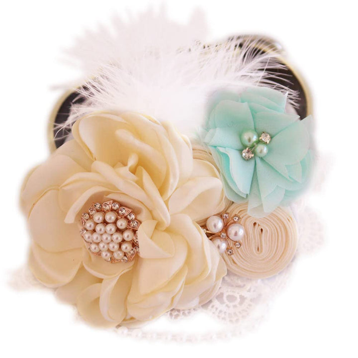 Handmade dog wedding collar featuring an ivory flower centerpiece, mint fabric flower accent, decorative feather detail, and pearl accents.