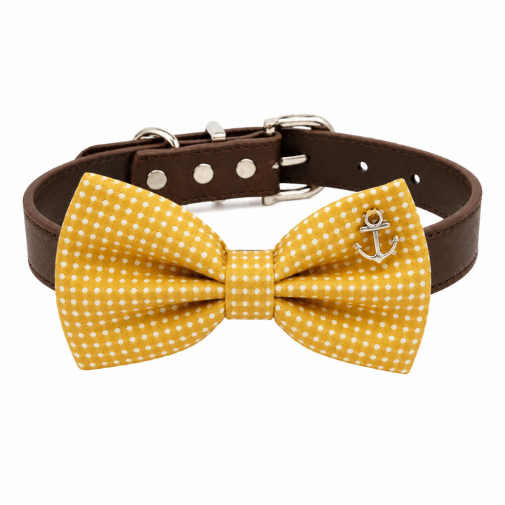 Mustard yellow polka dot dog bow tie collar with decorative anchor charm, brown vegan leather collar, and silver-tone hardware
