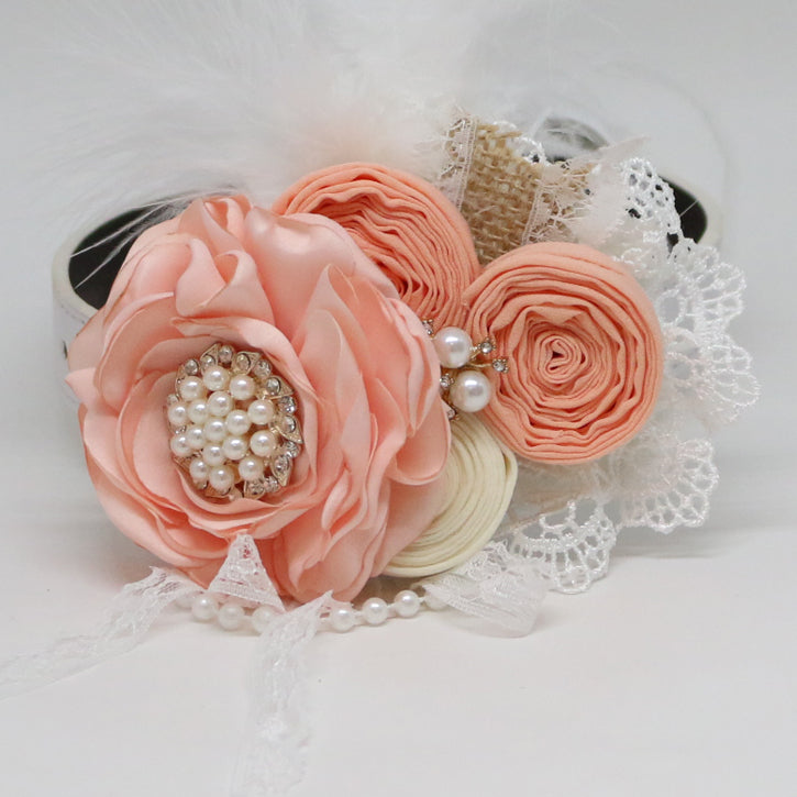 Handmade peach floral dog collar featuring pearl centerpiece, rolled fabric flowers, lace trim, feather accents, and elegant pearl details