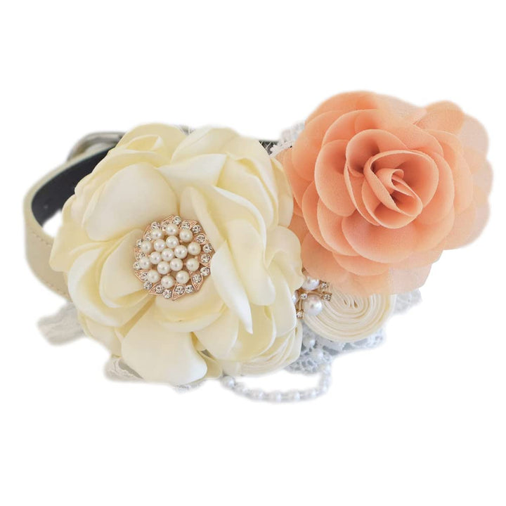 Handmade dog wedding collar featuring an ivory flower centerpiece, peach fabric rose accent, lace details, and pearl embellishments.