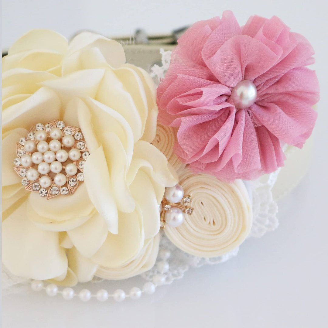Ivory floral dog collar with soft pink fabric flower accent, pearl centerpiece, lace trim, and decorative pearl details.