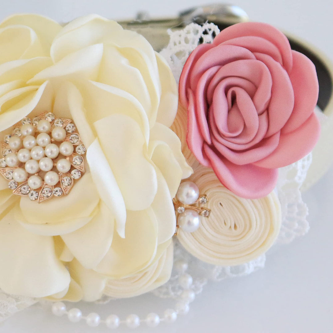 Ivory floral dog collar with soft pink rose accent, pearl brooch centerpiece, lace trim, and decorative pearl details.