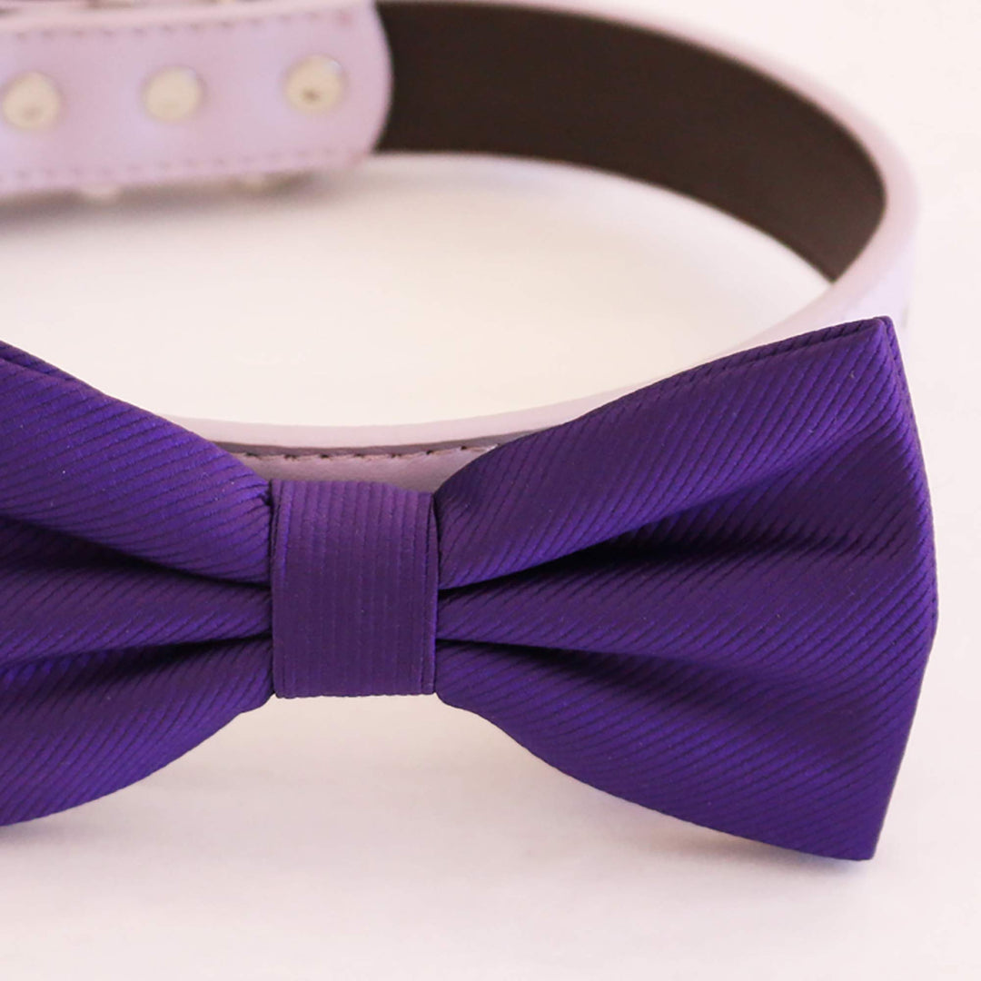 Purple satin dog bow tie with matching center band attached to a lilac vegan leather collar.