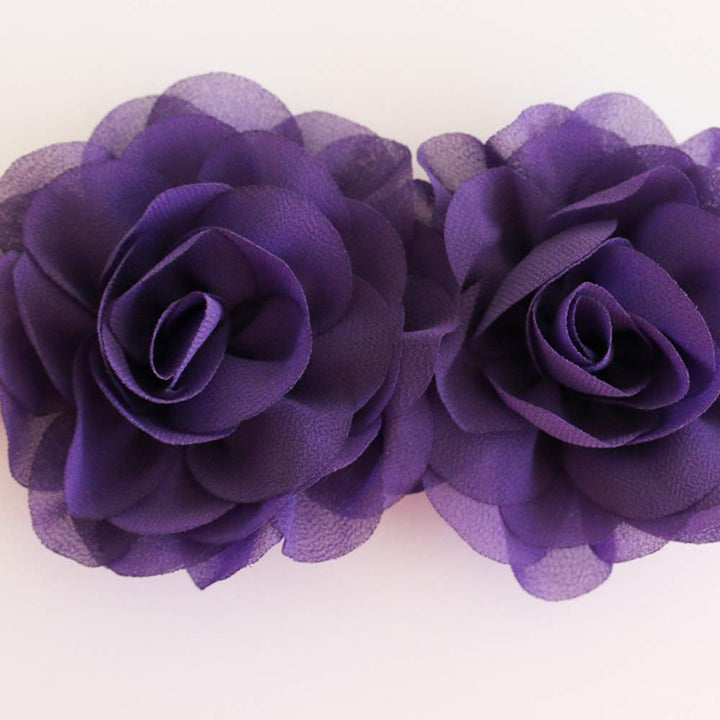 Close-up of deep purple chiffon rose flower dog collar with layered floral design and soft fabric petals.