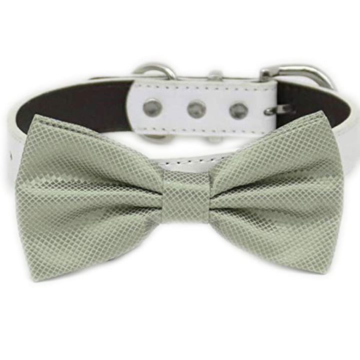 Sage green textured dog bow tie collar with white vegan leather collar and adjustable buckle.