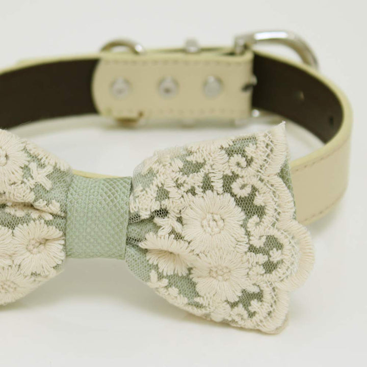 Close-up of sage green vintage lace dog bow tie showing floral embroidered lace overlay, scalloped edges, and handcrafted detailing
