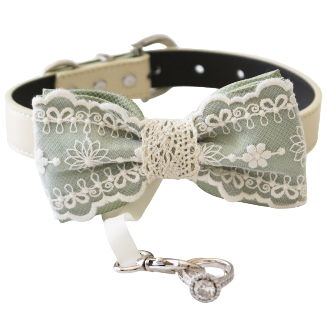 Sage green lace ring bearer dog bow tie attached to an ivory vegan leather collar with ribbon ring holder