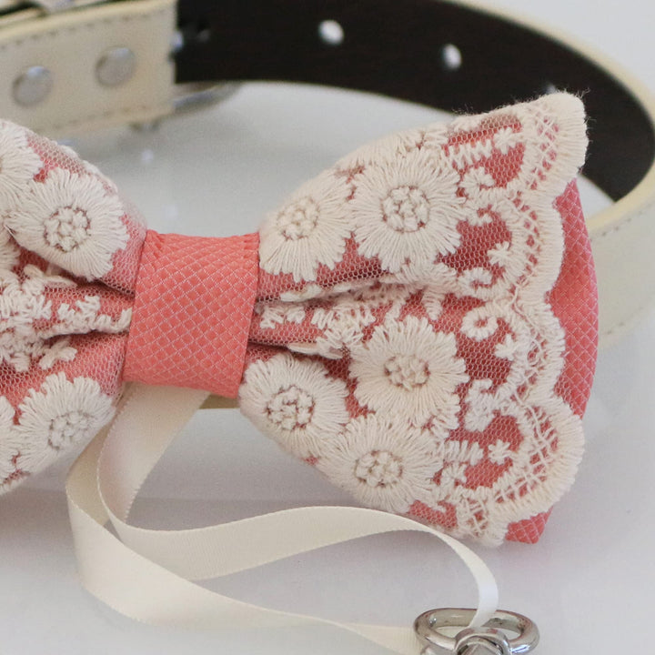 Salmon floral lace ring bearer dog bow tie close-up with embroidered flower lace overlay, textured center band, and attached wedding ring holder ribbon