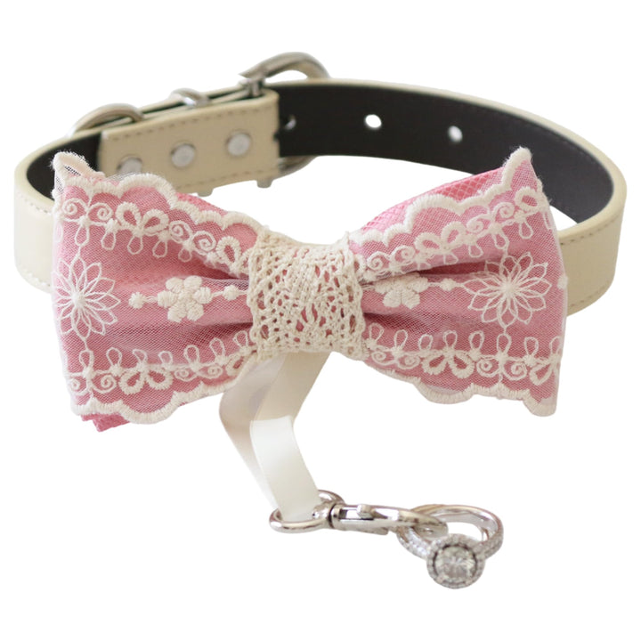 Soft pink lace dog bow tie collar with embroidered floral lace details, ivory vegan leather collar, adjustable fit, and attached ring bearer ribbon