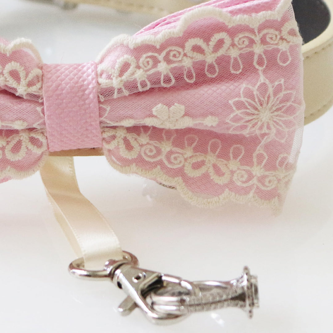 Soft pink ring bearer dog bow tie collar featuring elegant lace embroidery, satin center wrap, vegan leather collar, and attached wedding ring holder ribbon for weddings and formal events