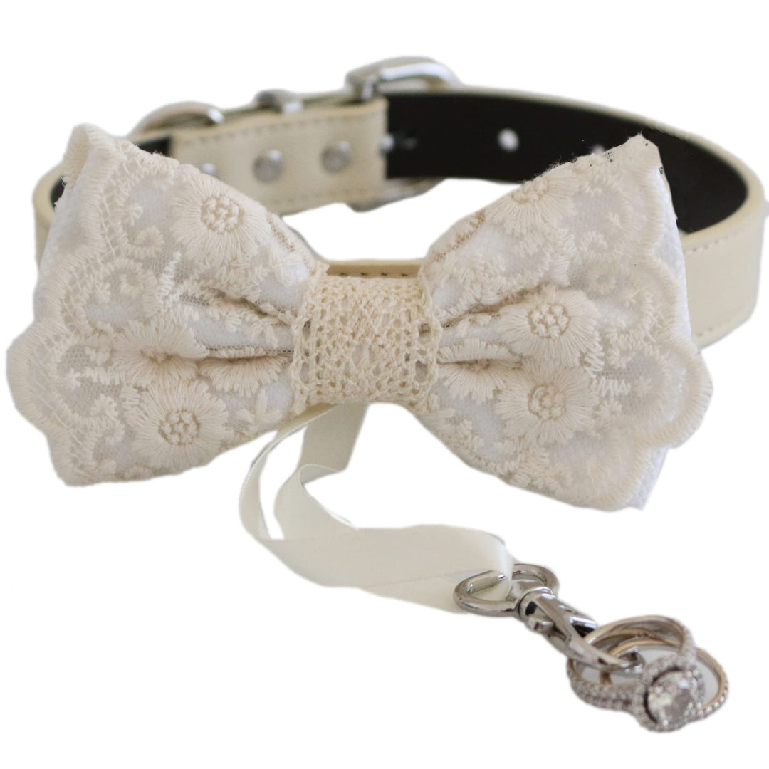 White lace ring bearer dog bow tie collar featuring embroidered floral lace pattern, attached wedding ring holder ribbon, decorative ring charm, and adjustable vegan leather collar for weddings and formal ceremonies