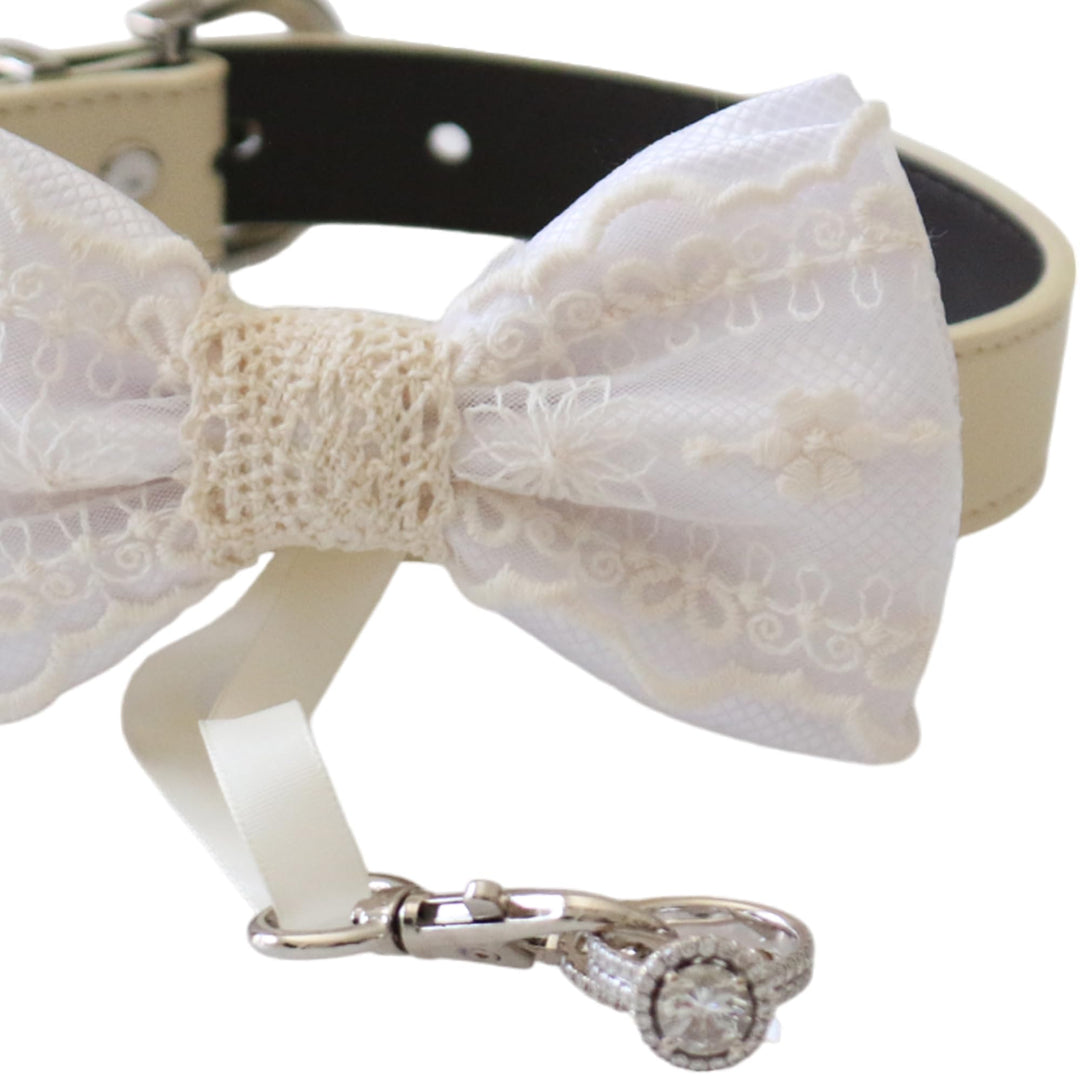 White lace ring bearer dog bow tie collar close-up showing embroidered lace details, attached wedding ring holder ribbon, decorative ring set, and adjustable vegan leather collar
