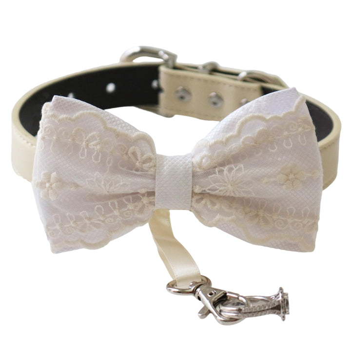 White ring bearer dog bow tie collar featuring elegant lace embroidery, satin center wrap, vegan leather collar, and attached wedding ring holder ribbon for weddings and formal occasions