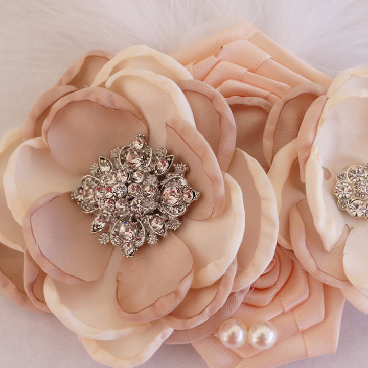 Blush and ivory floral dog collar with crystal brooch centerpiece, pearl accents, and layered flower design.