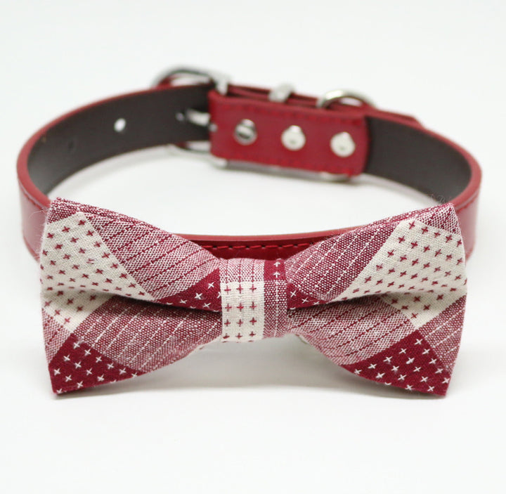 Burgundy and cream patchwork dog bow tie attached to a matching burgundy vegan leather dog collar.